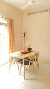 a dining room table and chairs in a room at Vision Homestay in Seremban