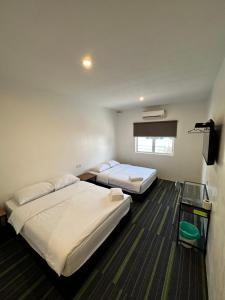 Postel nebo postele na pokoji v ubytování Olive Bedz Hotel