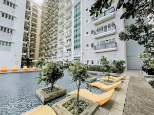 a courtyard with a swimming pool in a building at Megaworld-Manduriao, Iloilo Lafayette in Iloilo City