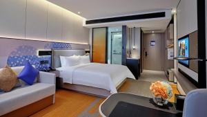 Voodi või voodid majutusasutuse Hampton by Hilton Shenzhen North Station toas