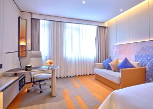 Televiisor ja/või meelelahutuskeskus majutusasutuses Hampton by Hilton Shenzhen North Station