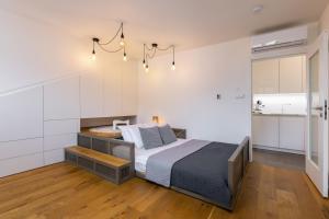 a bedroom with a large bed in a room at Luxurious, charming studio perfect for couples in Prague