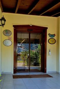 an entrance to a building with a revolving door at Efe Hotel Gocek in Göcek