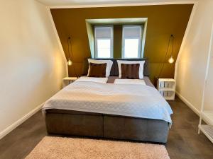 Postel nebo postele na pokoji v ubytování Geschmackvolle Ferienwohnung in Markkleeberg