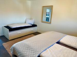 Postel nebo postele na pokoji v ubytování Geschmackvolle Ferienwohnung in Markkleeberg