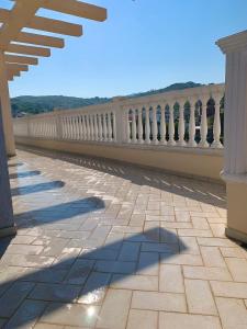 a shadow of a person on a balcony at Apartament Real Vlore in Vlorë