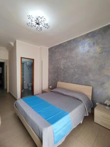 Postel nebo postele na pokoji v ubytování Albergo Primavera