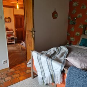 Postel nebo postele na pokoji v ubytování La Longère d'Ecottes