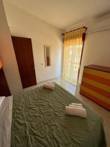 A bed or beds in a room at Casa del Sol