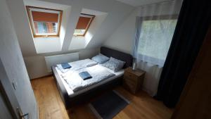 Posteľ alebo postele v izbe v ubytovaní Mýto Apartments BERGMAX, Ski Jasná Chopok 10min transit - Resort Mýto Apartments, parking free