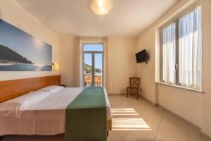 Кровать или кровати в номере Lido Resort