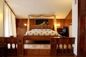 a bedroom with a bed with a canopy at Casale del fattore in Cesena