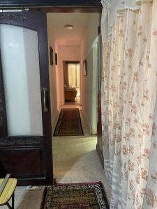 a hallway with a door leading into a room at شقه مفروشه سوبر لوكس بميامى الاسكندريه in Alexandria