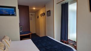Postel nebo postele na pokoji v ubytování Hotel Le Marin