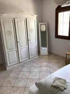 Ein Bett oder Betten in einem Zimmer der Unterkunft Casa Su Soli Sardu 10 - Mit Blick aufs Meer!