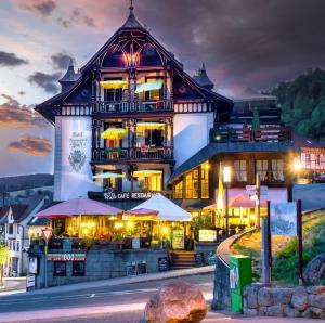 a large building with a restaurant in front of it at Hotel Pfaff in Triberg