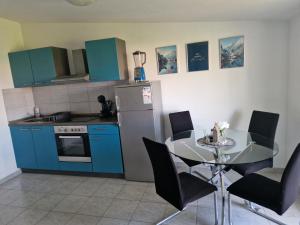 Kuchyň nebo kuchyňský kout v ubytování Apartmani Tereza