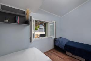 Ένα ή περισσότερα κρεβάτια σε δωμάτιο στο Green House +32 φωτογραφίες