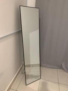 a mirror sitting on the floor next to a wall at Ssrhomestay/S2/Corner lot/15pax in Seremban