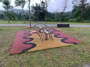 a small playground in the middle of a park at Ssrhomestay/S2/Corner lot/15pax in Seremban