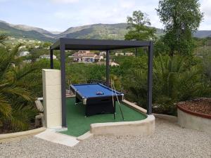 a pool table in a gazebo on a patio at French Riviera Gaudissard in Vence