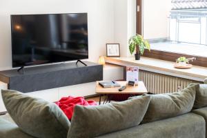 a living room with a couch and a table at dreamcation Apartments - Altstadt Kelheim in Kelheim