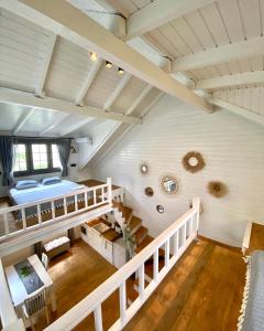 an attic room with a bunk bed and stairs at Egeos Lake House in Sakarya