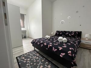 a bedroom with a bed with two towels on it at Apartment Tilia in Otočac