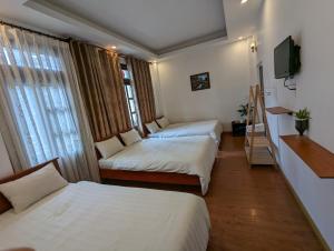Postel nebo postele na pokoji v ubytování Holly Hostel