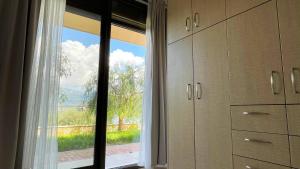 a room with a large window with a view at Michael's House - Argostoli in Argostoli