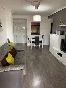 a living room with a couch and a table at Apartamento Costa Marina 3 in El Borseral