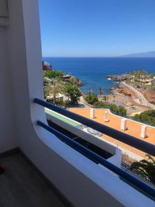 a view of the ocean from a balcony of a building at Ocean View Sunset in Adeje