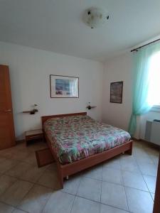 Postel nebo postele na pokoji v ubytování La casa sul lago