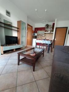 a living room with a couch and a coffee table at La casa sul lago in  Monvalle 