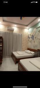Postel nebo postele na pokoji v ubytování MOTEL MINH ANH