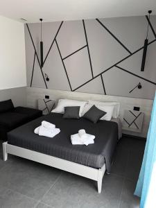 Postel nebo postele na pokoji v ubytování B&B A due passi dal mare