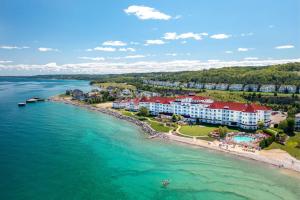 an aerial view of a resort on the shore of the water at Inn at Bay Harbor, Autograph Collection in Petoskey