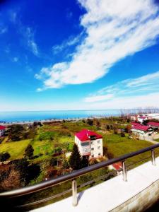 a view from a balcony of a house and the ocean at elva suites ardeşen in Ardeşen
