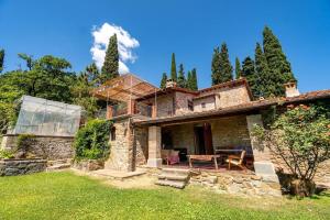 an exterior view of a stone house at Tuscan Countryside Paradise with Pool in Cavriglia
