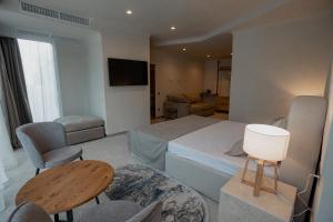Кровать или кровати в номере Marine Residence Sea View