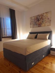 a bedroom with a large bed in a room at Villa Milan in Vinkuran