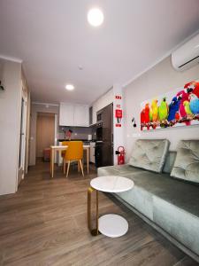 a living room with a couch and a table at Apartamento MS in Campo Maior +15 photos