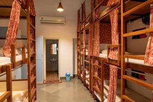 a room with a bunch of bunk beds at Jaipur Jantar Hostel in Jaipur