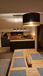 A kitchen or kitchenette at Apartmán 17, Vysoké Tatry, Dolný Smokovec