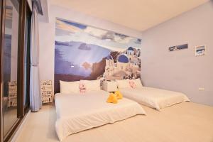 Postel nebo postele na pokoji v ubytování Ching Yu Rou B&B