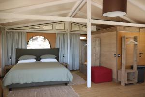 Postel nebo postele na pokoji v ubytování Glamping La Ghianda