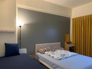 Un pat sau paturi într-o cameră la Duke 369