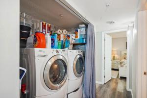 a laundry room with a washer and dryer at Trillium 3A - Premier in St Pete Beach