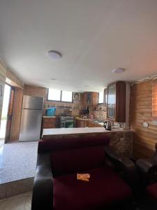 a kitchen with a refrigerator and a counter top at Elegant housing in Jerash