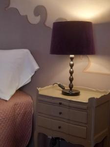Łóżko lub łóżka w pokoju w obiekcie La Casa Rosa